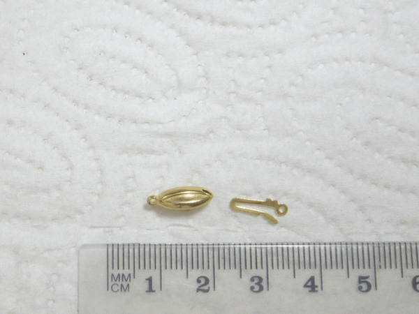 Vergoldete Silberschließe, Tönnchen